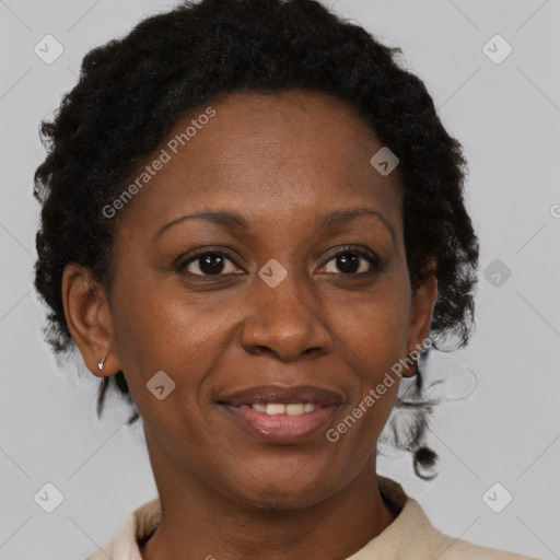 Joyful black adult female with medium  brown hair and brown eyes