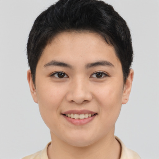 Joyful asian young-adult female with short  brown hair and brown eyes