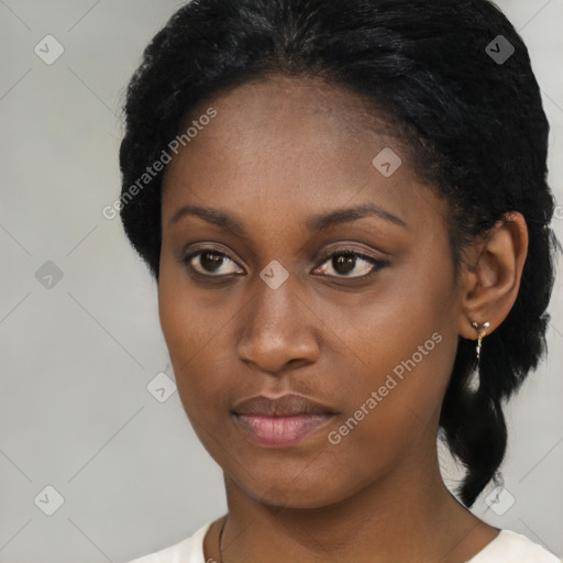 Neutral black young-adult female with short  black hair and brown eyes