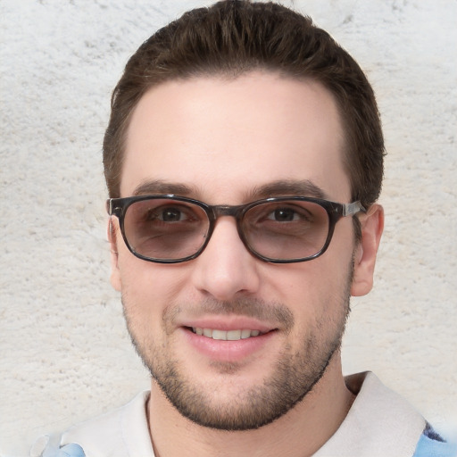 Joyful white young-adult male with short  brown hair and blue eyes