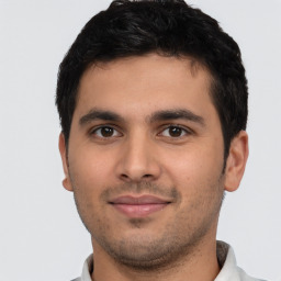 Neutral latino young-adult male with short  black hair and brown eyes