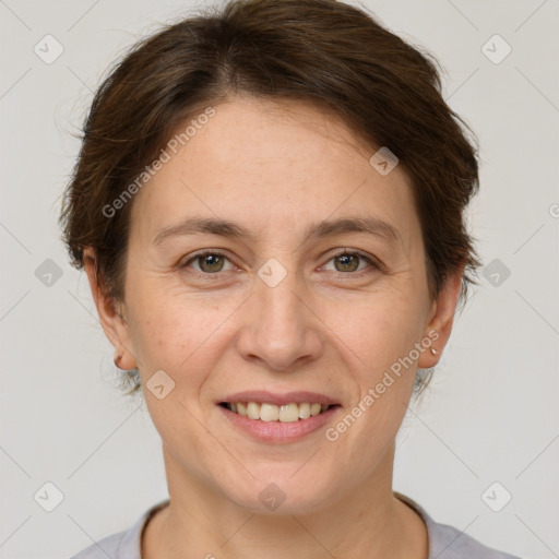 Joyful white adult female with short  brown hair and brown eyes