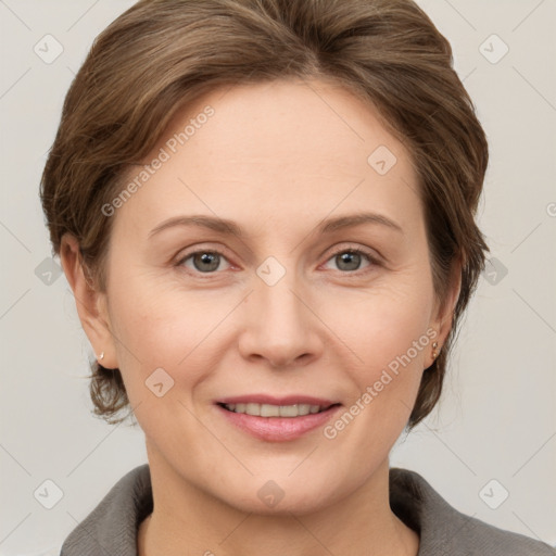 Joyful white adult female with medium  brown hair and grey eyes