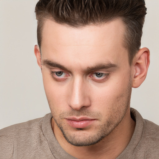 Neutral white young-adult male with short  brown hair and brown eyes