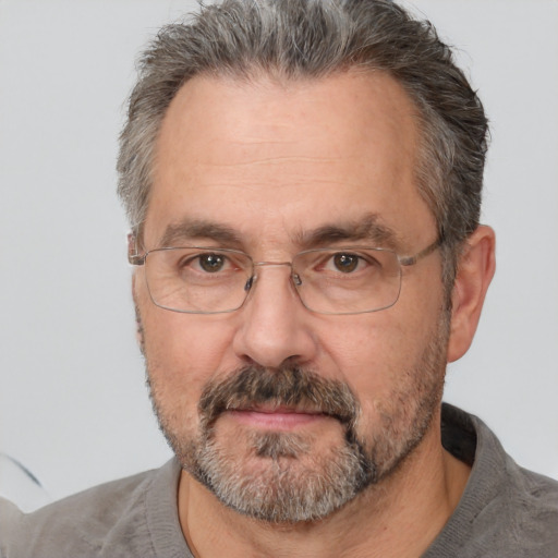 Neutral white middle-aged male with short  gray hair and brown eyes