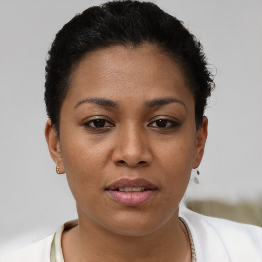 Joyful latino young-adult female with short  brown hair and brown eyes