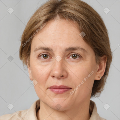 Joyful white adult female with medium  brown hair and grey eyes