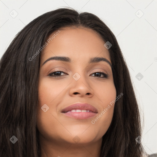 Joyful latino young-adult female with long  brown hair and brown eyes