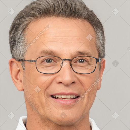 Joyful white middle-aged male with short  gray hair and grey eyes