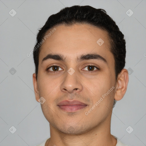 Joyful white young-adult male with short  black hair and brown eyes