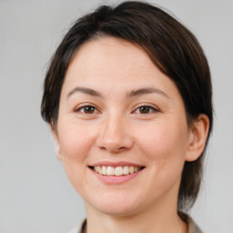 Joyful white young-adult female with medium  brown hair and brown eyes