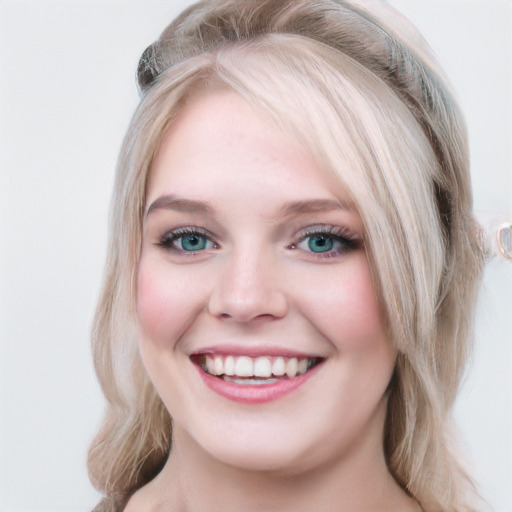 Joyful white young-adult female with long  brown hair and blue eyes