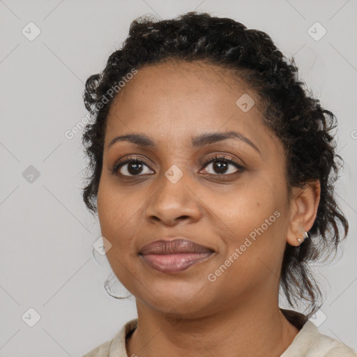 Joyful black young-adult female with medium  black hair and brown eyes