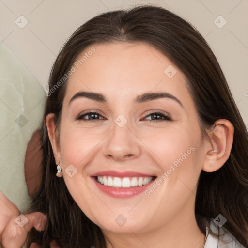 Joyful white young-adult female with medium  brown hair and brown eyes