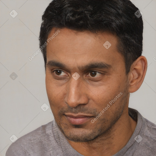 Neutral latino young-adult male with short  black hair and brown eyes