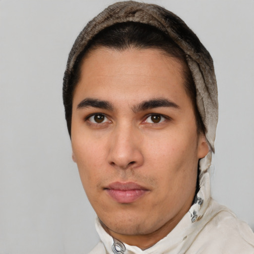 Neutral latino young-adult male with short  brown hair and brown eyes