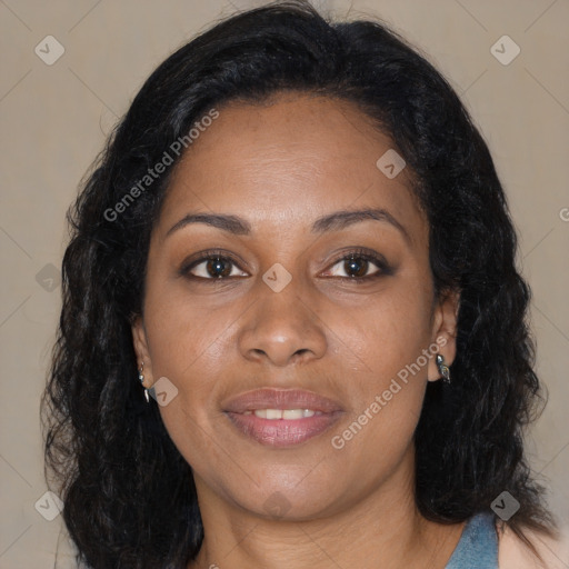 Joyful black young-adult female with long  brown hair and brown eyes