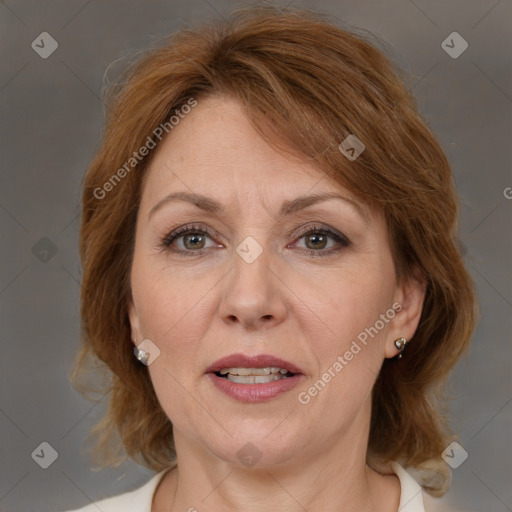 Joyful white adult female with medium  brown hair and brown eyes