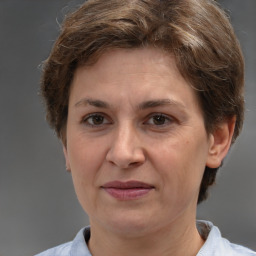 Joyful white adult female with short  brown hair and brown eyes