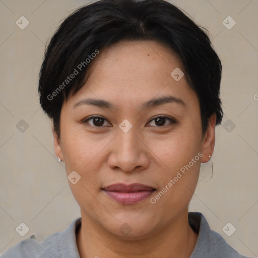 Joyful asian young-adult female with short  brown hair and brown eyes