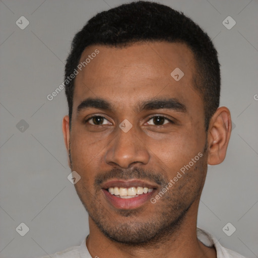 Joyful black young-adult male with short  black hair and brown eyes