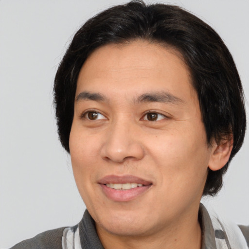 Joyful white adult male with medium  brown hair and brown eyes