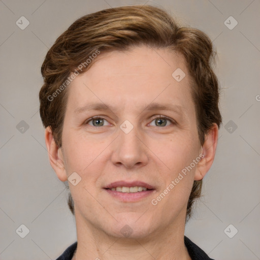 Joyful white adult female with short  brown hair and grey eyes