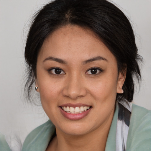 Joyful white young-adult female with medium  brown hair and brown eyes