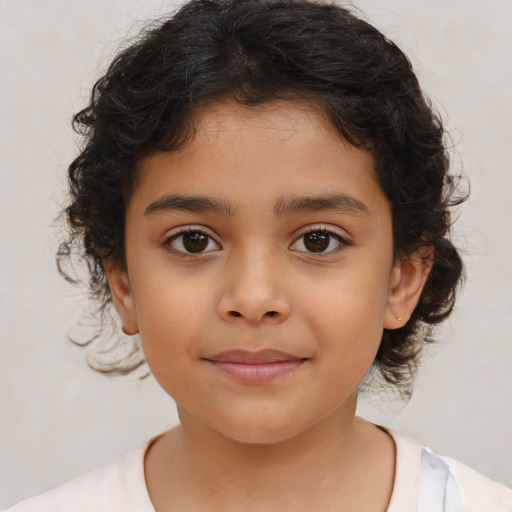 Joyful latino child female with medium  brown hair and brown eyes