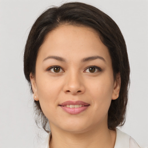 Joyful asian young-adult female with medium  brown hair and brown eyes