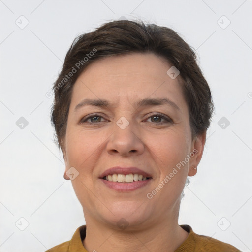 Joyful white adult female with short  brown hair and brown eyes