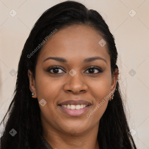 Joyful black young-adult female with long  brown hair and brown eyes