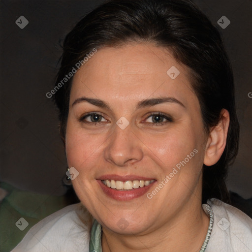 Joyful white adult female with long  brown hair and brown eyes