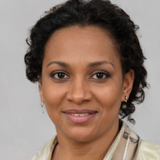 Joyful latino adult female with short  brown hair and brown eyes