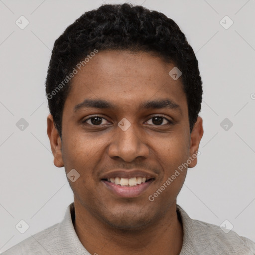 Joyful black young-adult male with short  black hair and brown eyes