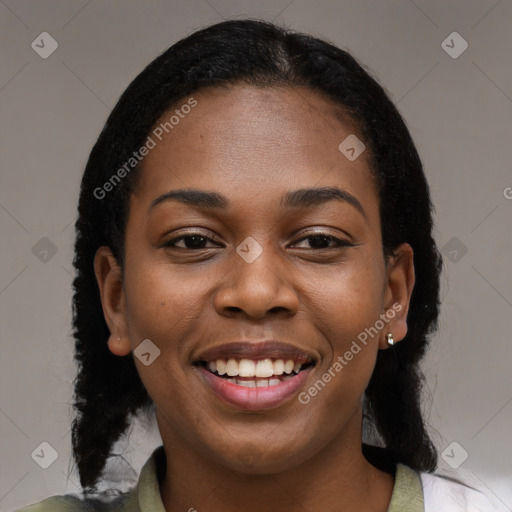 Joyful black young-adult female with medium  black hair and brown eyes