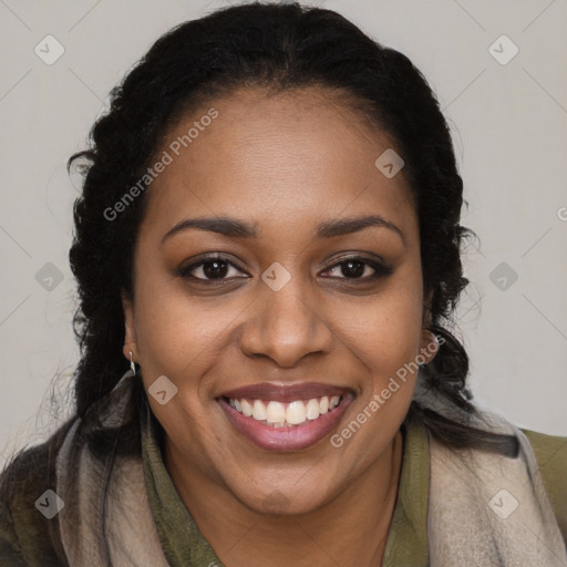 Joyful black young-adult female with long  brown hair and brown eyes