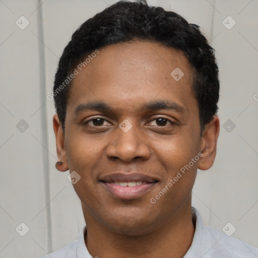 Joyful black young-adult male with short  black hair and brown eyes