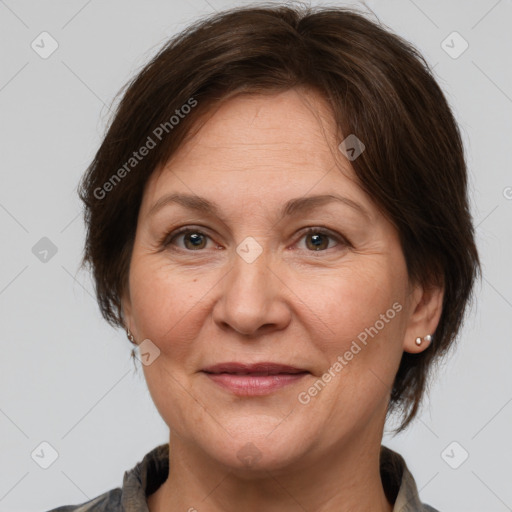 Joyful white adult female with medium  brown hair and brown eyes