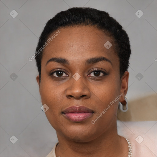 Joyful black young-adult female with short  black hair and brown eyes