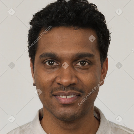 Joyful black young-adult male with short  black hair and brown eyes