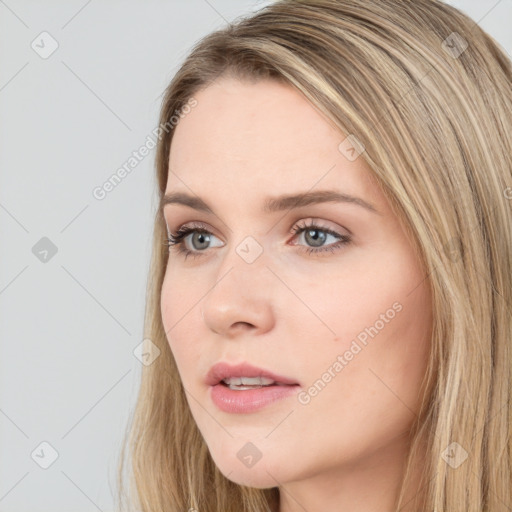 Neutral white young-adult female with long  brown hair and green eyes