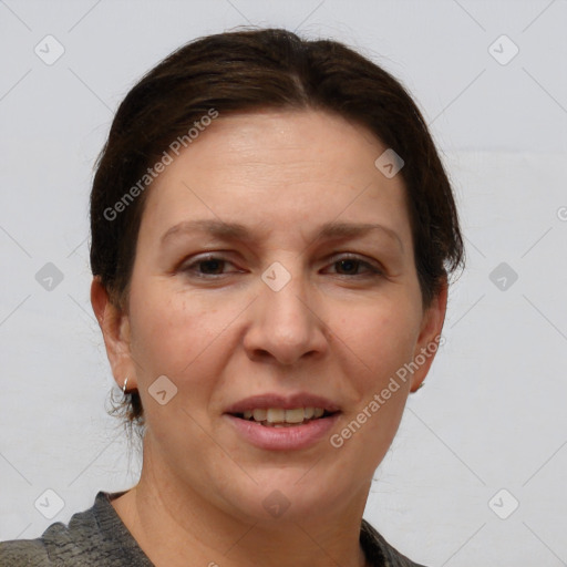 Joyful white adult female with short  brown hair and grey eyes