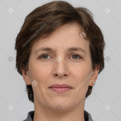 Joyful white adult female with short  brown hair and grey eyes