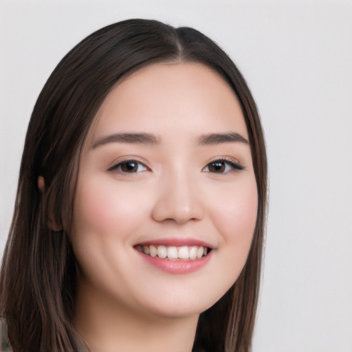 Joyful white young-adult female with long  black hair and brown eyes