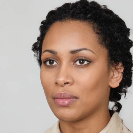 Neutral black young-adult female with medium  black hair and brown eyes