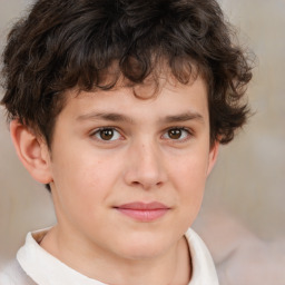 Joyful white child male with short  brown hair and brown eyes