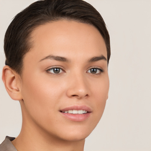 Joyful white young-adult female with short  brown hair and brown eyes