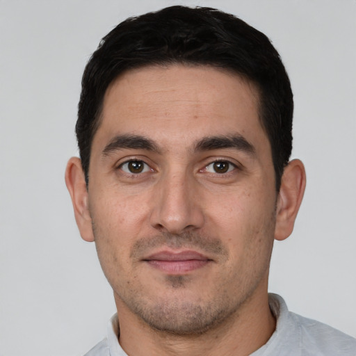 Neutral white young-adult male with short  black hair and brown eyes