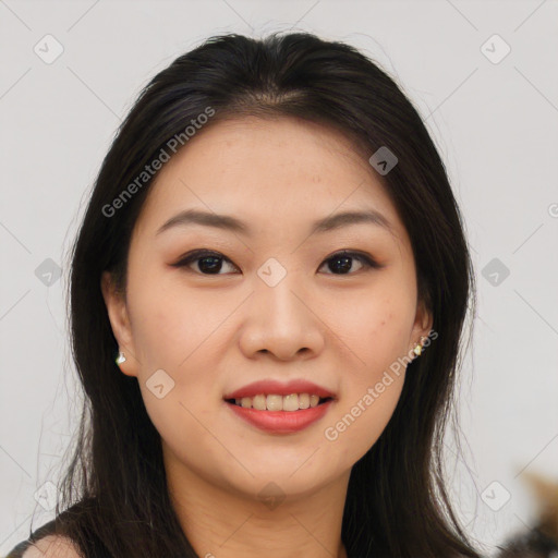 Joyful asian young-adult female with long  brown hair and brown eyes